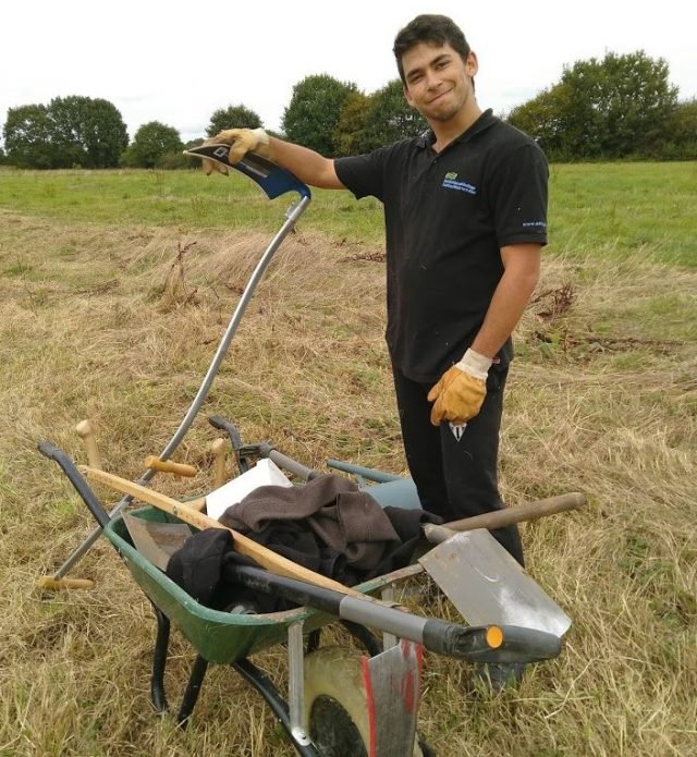 Floran scything in our field